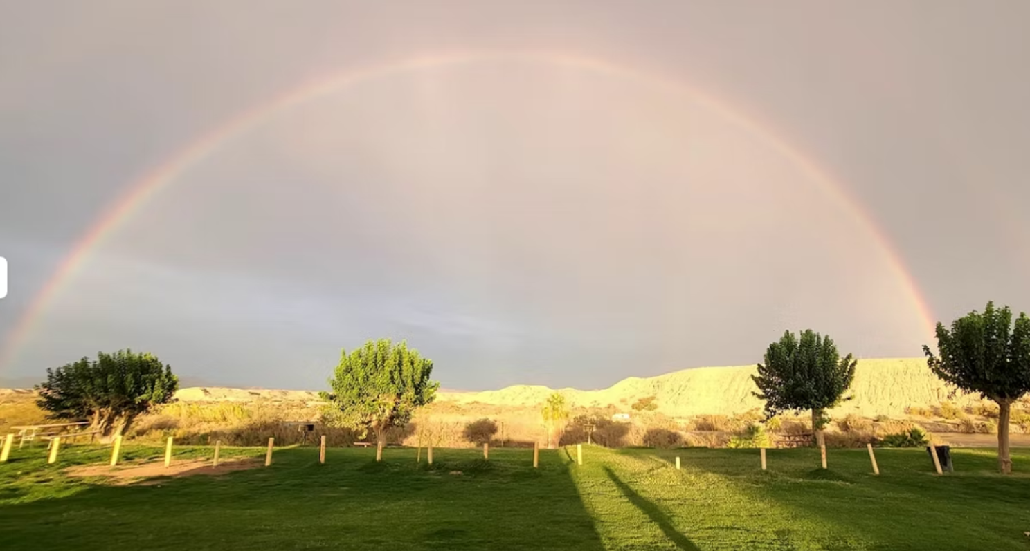 Full rainbow over McIntyre Resort grounds